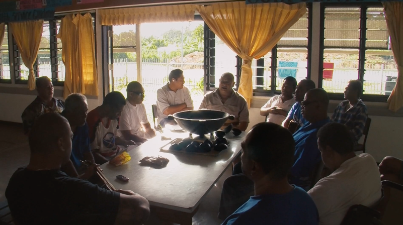 Dr Mapa Puloka drinking Kava with his patients